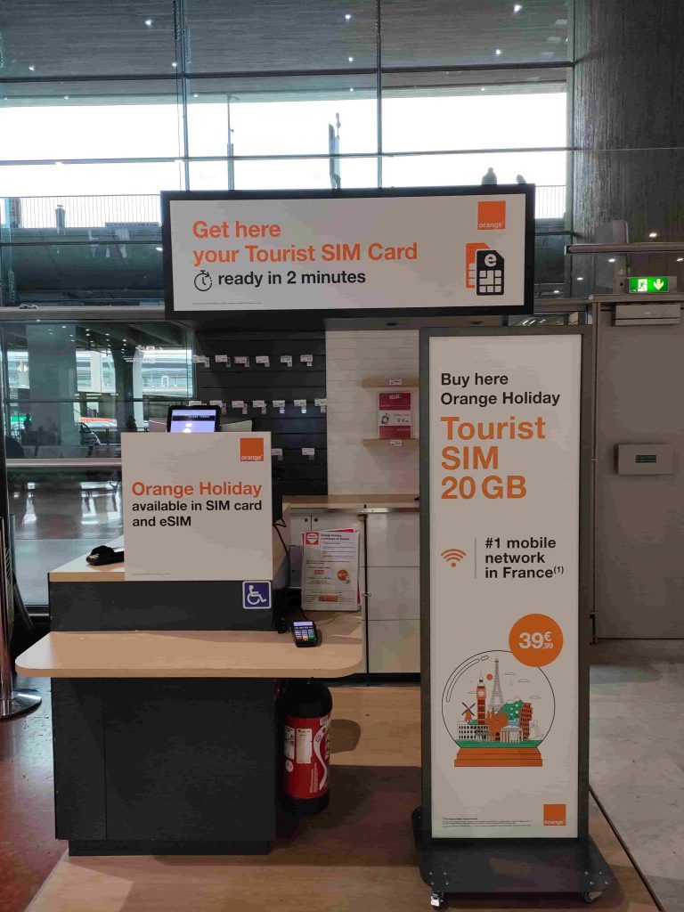 Orange kiosk in Terminal 2E CDG Airport
